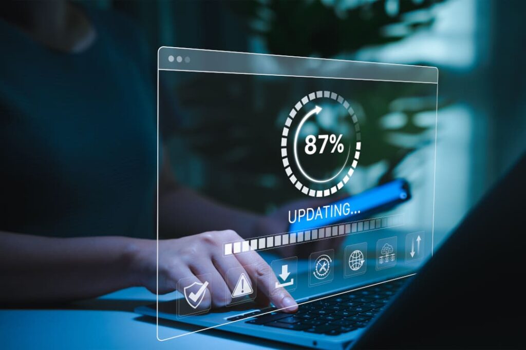 Symbolbild zur WordPress Wartung – Laptop mit Update-Fortschritt und digitaler Benutzeroberfläche